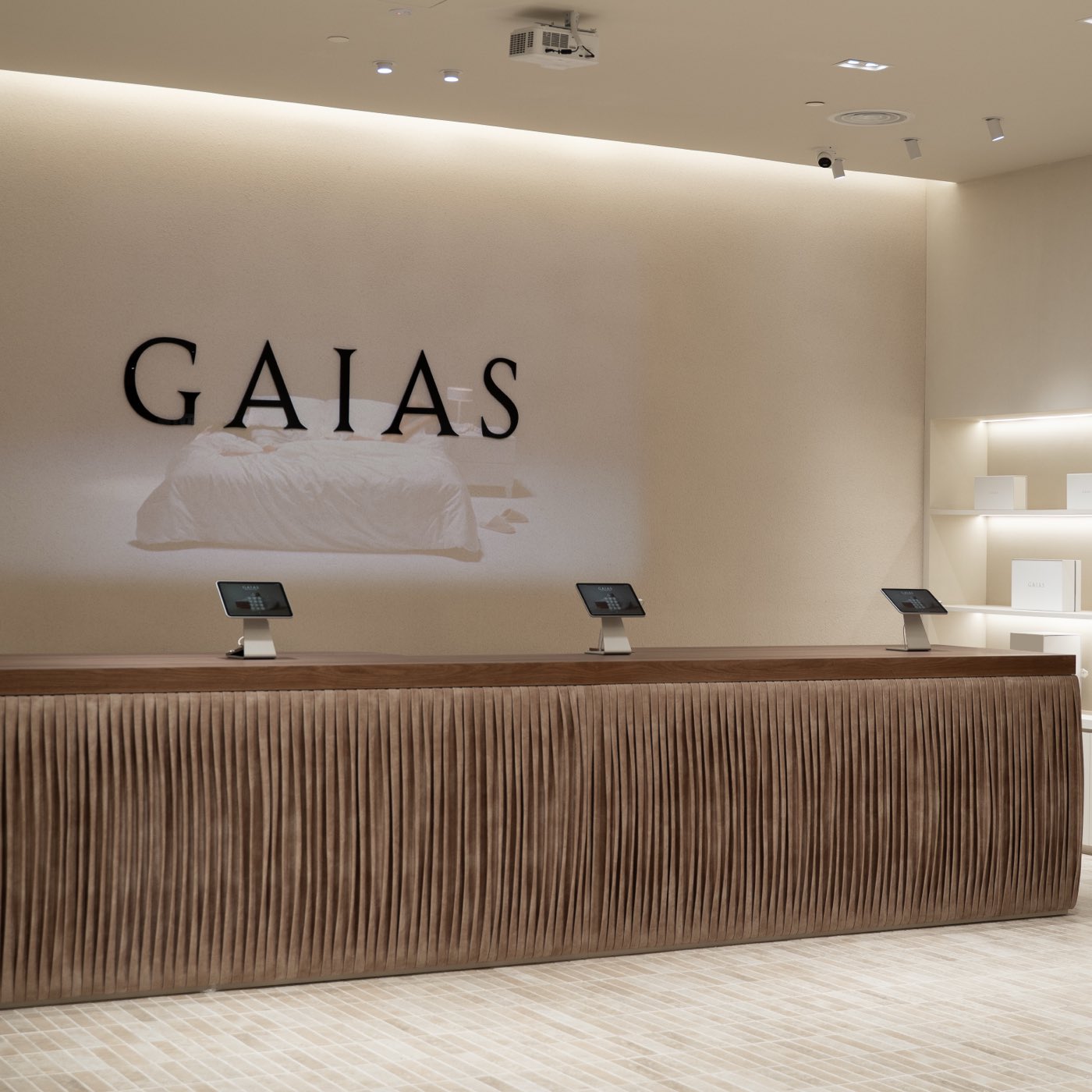 The GAIAS store at Mid Valley Southkey — the wordmark above a fluted timber counter